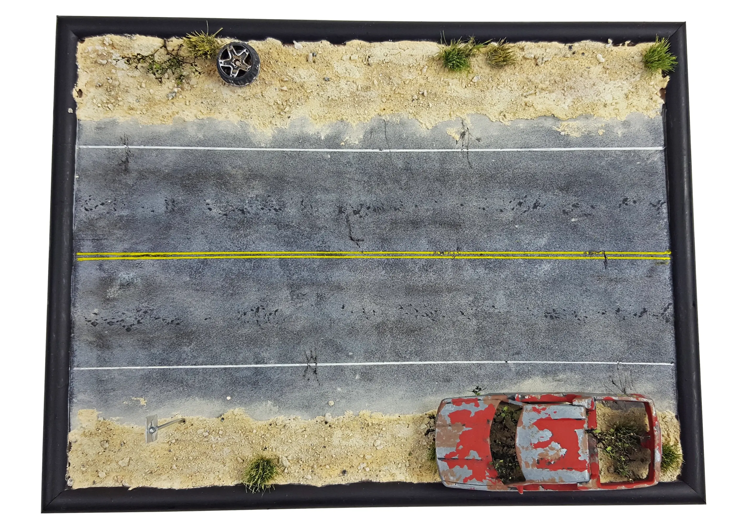 Asphalt road in desert from the air - miniature diorama