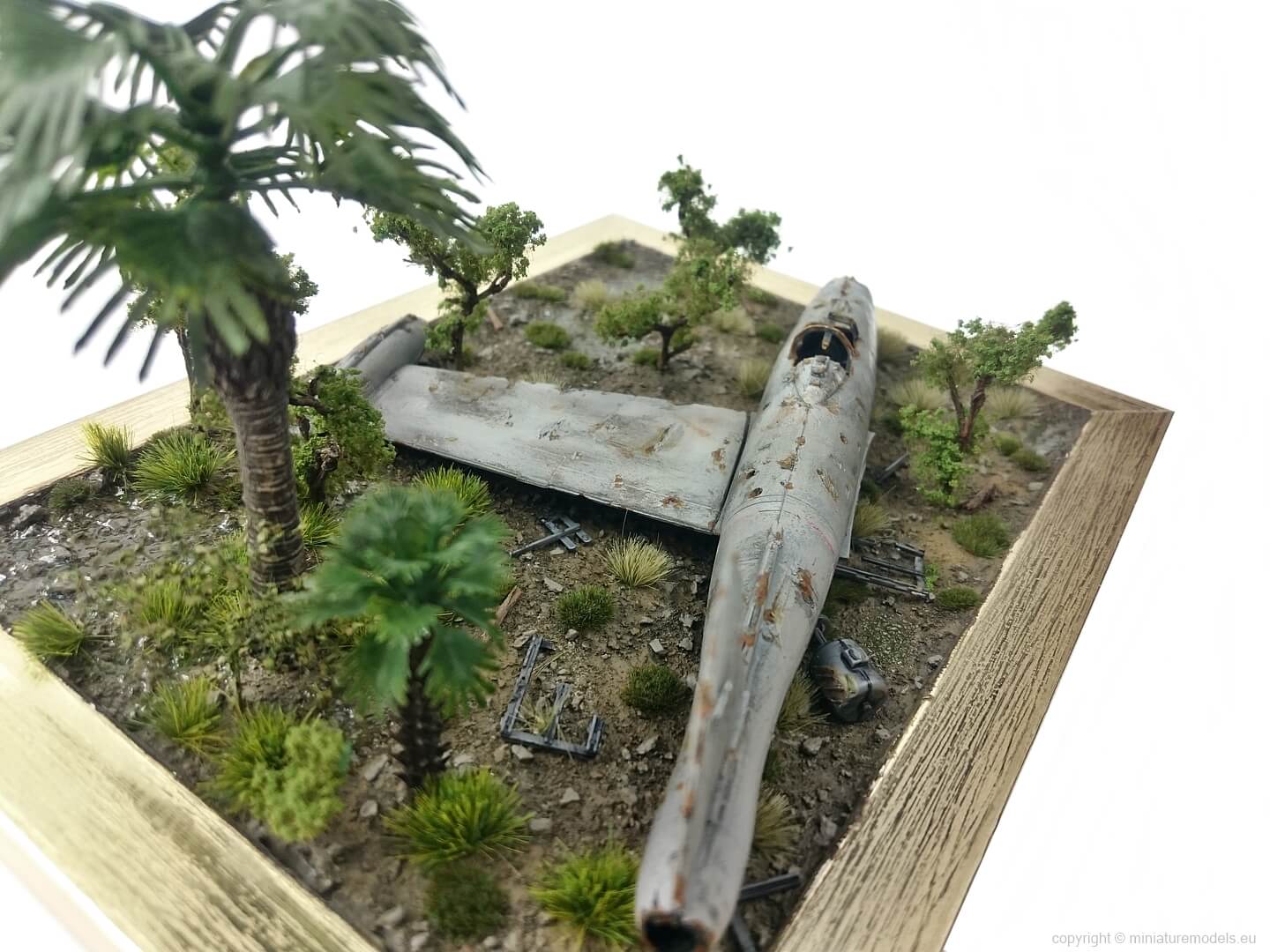 diorama of crashed rusty plane